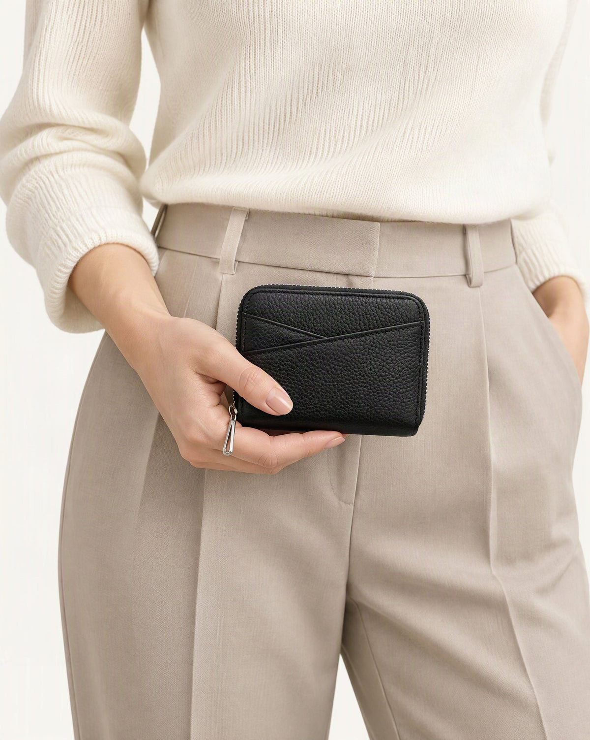 Genuine Leather Coin Purse with RFID Blocking Card Slots held in hand by a model