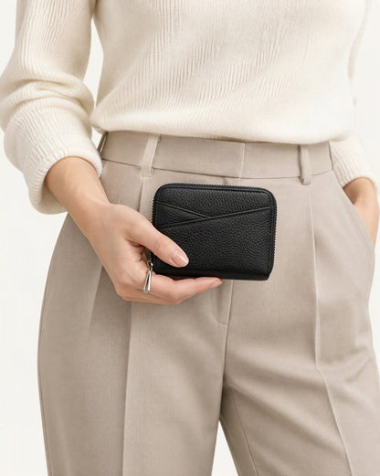 Genuine Leather Coin Purse with RFID Blocking Card Slots held in hand by a model