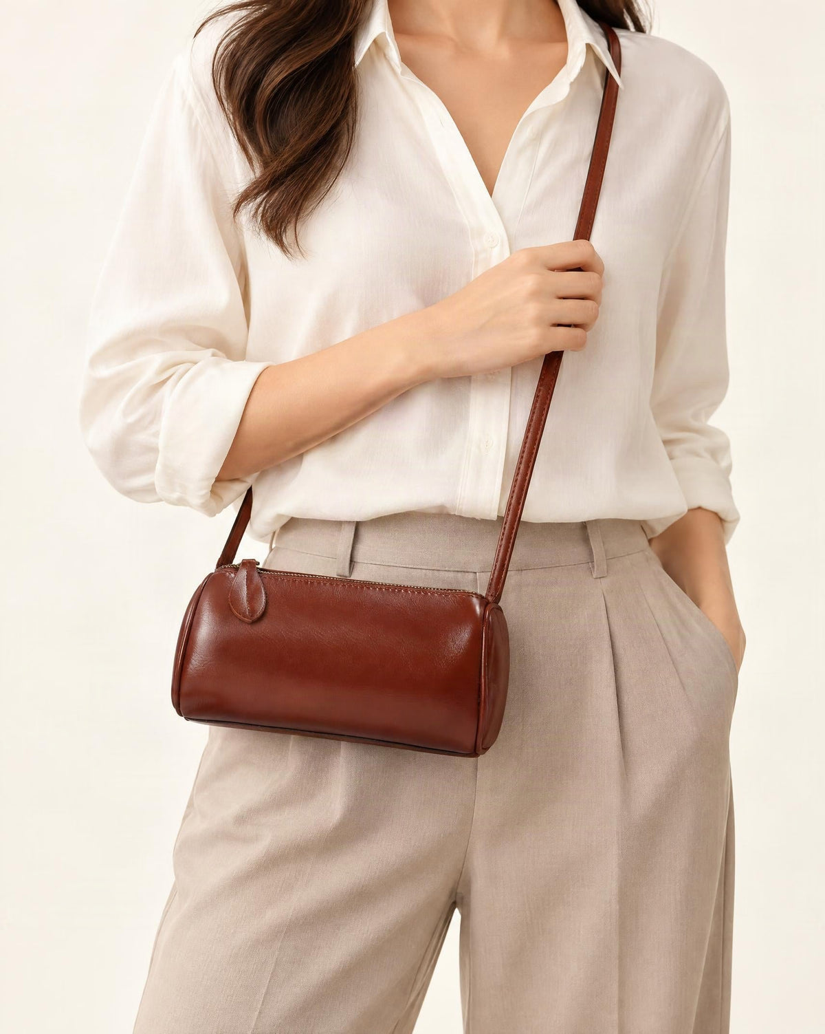Top-Grain Cowhide Mini Barrel Crossbody Bag worn crossbody