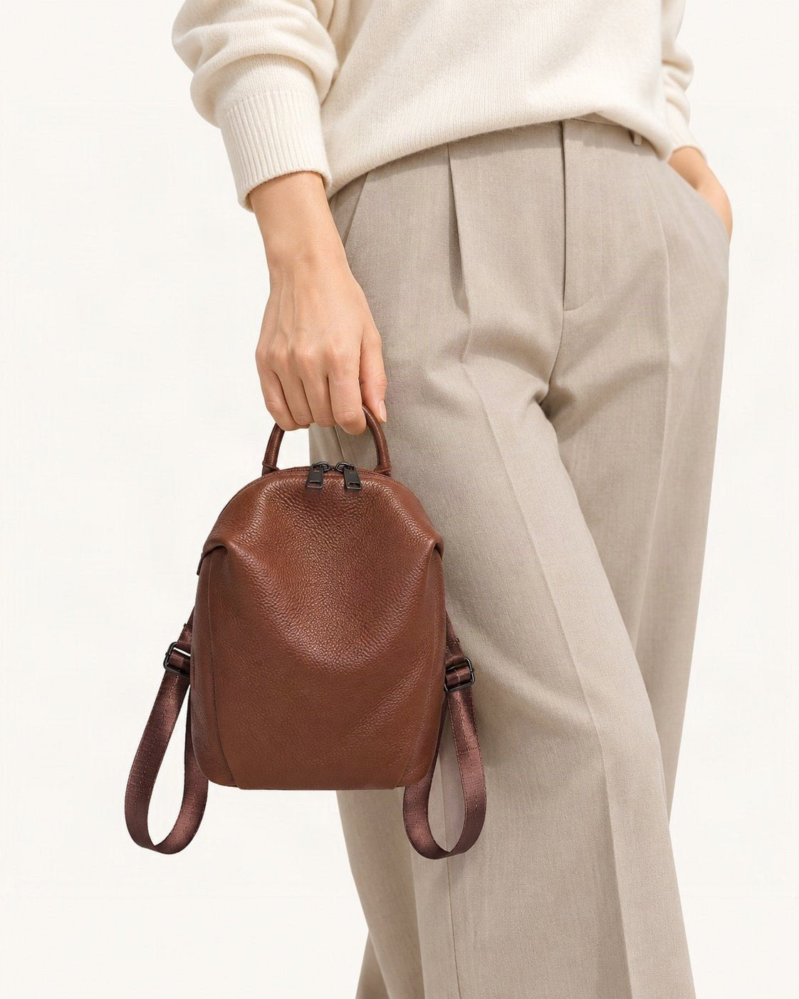 Top-Grain Cowhide Mini Backpack worn as a backpack