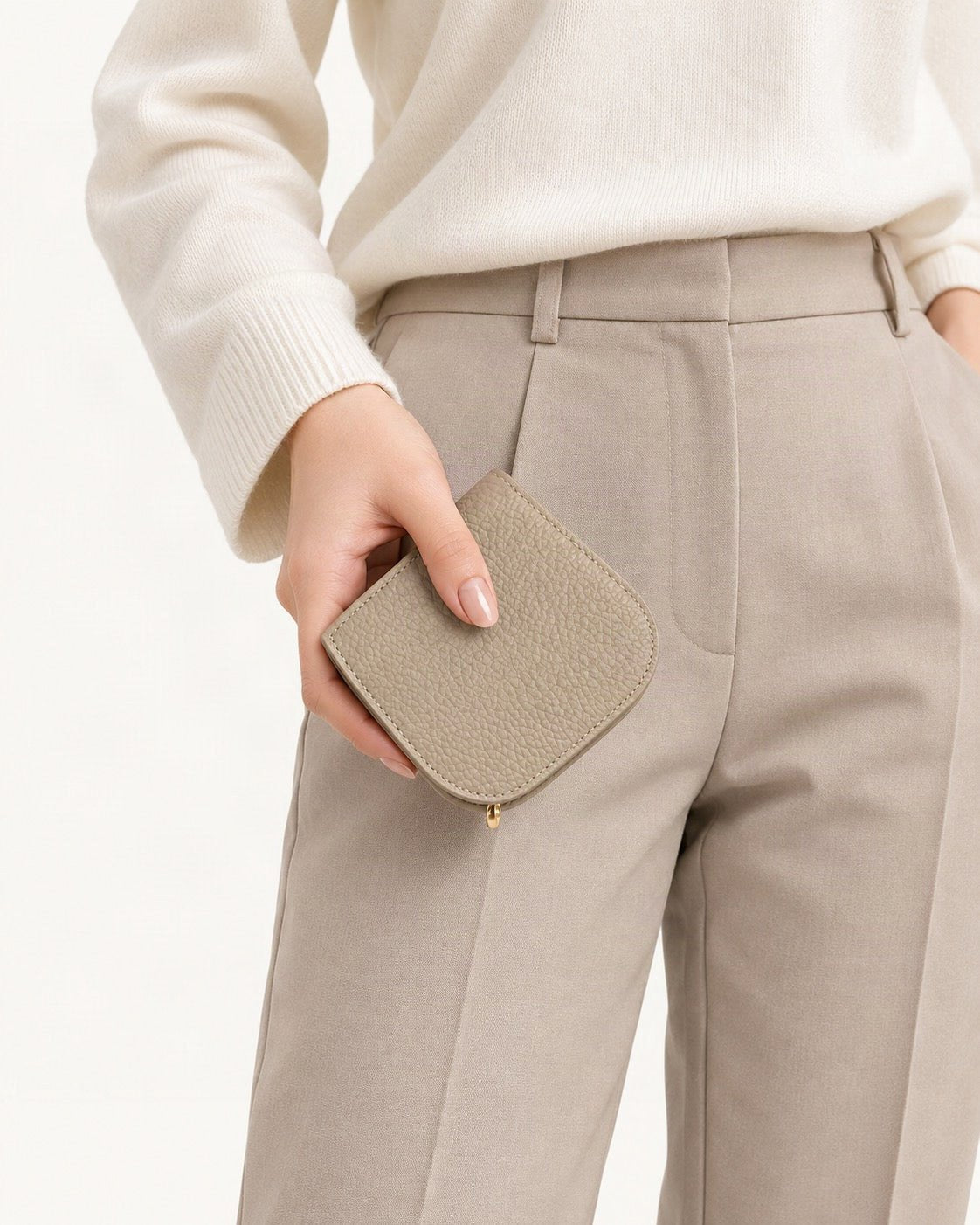 Cowhide Leather Compact Bifold Wallet held in hand by a model