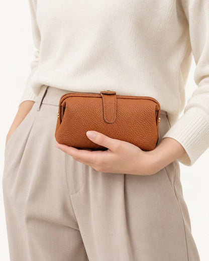 Top-Grain Cowhide Cosmetic Pouch – Color Options held in hand by a model