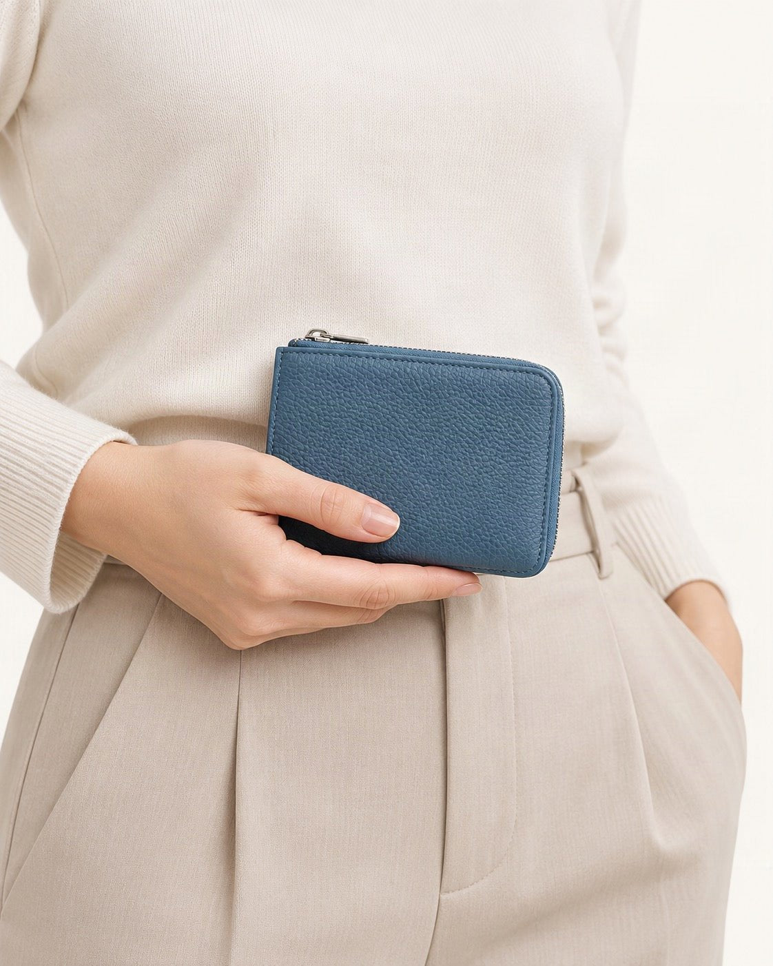 Leather Coin Wallet RFID 6 Pockets 4 Slots held in hand by a model