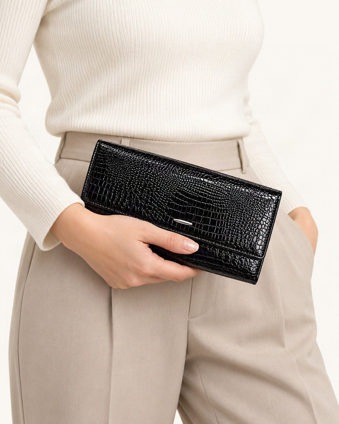 Top-Grain Cowhide Clutch Wallet held in hand by a model