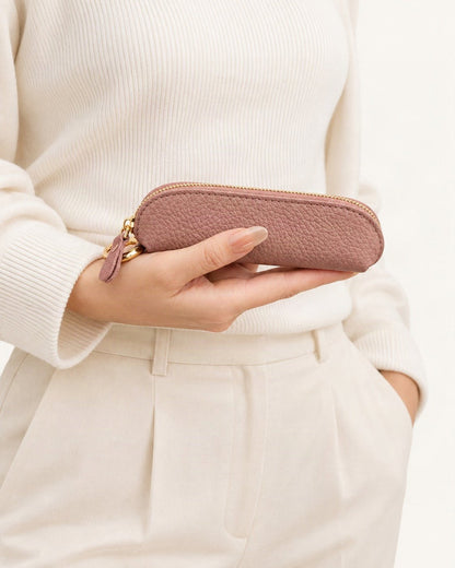 Top-Grain Cowhide Mini Zip Coin Purse with Key Clip held in hand by a model