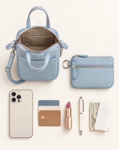 What fits in the Pebbled Cowhide Micro Crossbody Bag: phone, cards, lipstick, pen, folded notes and the detachable pouch