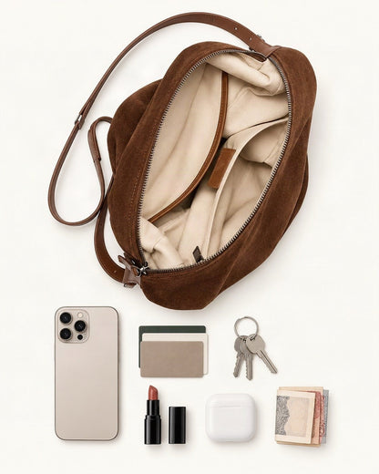 What fits in the Suede Leather Small Shoulder Bucket Bag: a 6.9-inch phone (iPhone 16 Pro Max), cards, keys, a lipstick, AirPods in their case, folded notes
