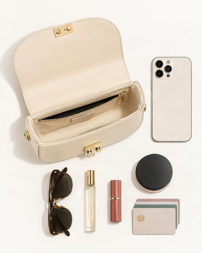 What fits in the Cowhide Leather Mini Saddle Crossbody Bag with Push Lock: smartphone up to 6.9 in, folded sunglasses, a 10 ml travel perfume, a lipstick, a compact powder, cards