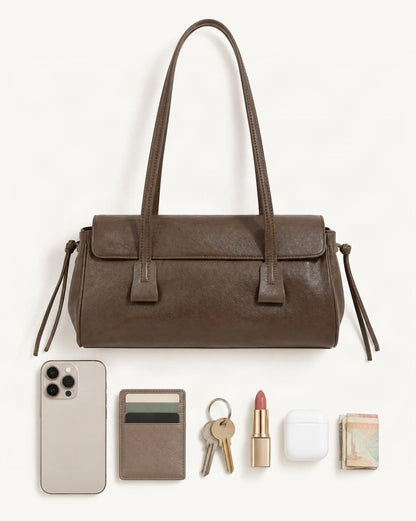 What fits in the Cowhide Leather Small Plus Shoulder Bag with Top Handles: smartphone up to 6.9 in, cards, keys, a lipstick, airpods in their case, a few banknotes folded over into a small stack, no complete flat bill face showing