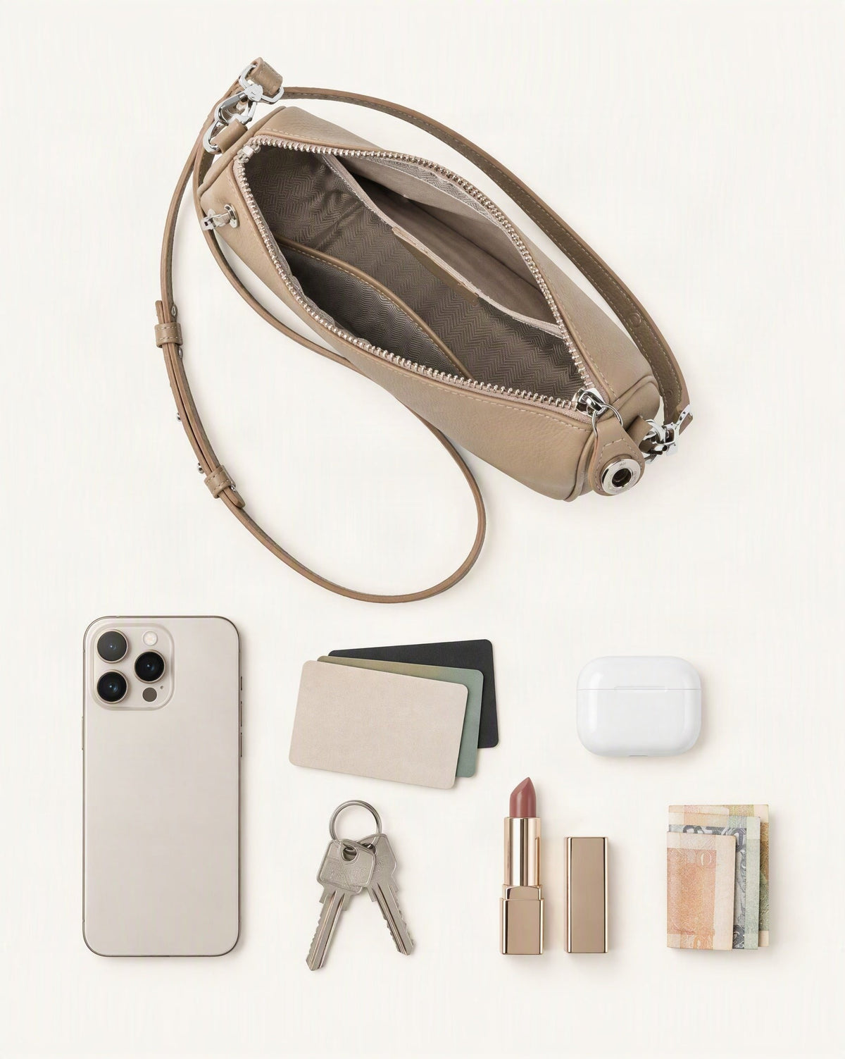 What fits in the Pebbled Cowhide Leather Crossbody Bag: smartphone up to 6.9 in, cards, keys, a lipstick, airpods in their case, a few banknotes folded over into a small stack, no complete flat bill face showing