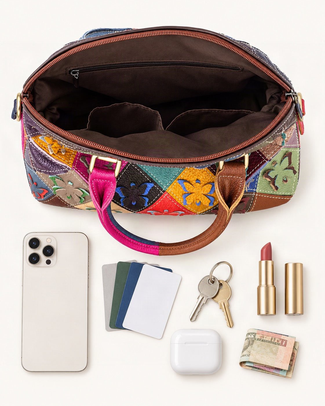 What fits in the Top-Grain Cowhide Small Plus Shell Shoulder Bag: smartphone up to 6.9 in, cards, keys, a lipstick, airpods in their case, a few banknotes folded over into a small stack, no complete flat bill face showing