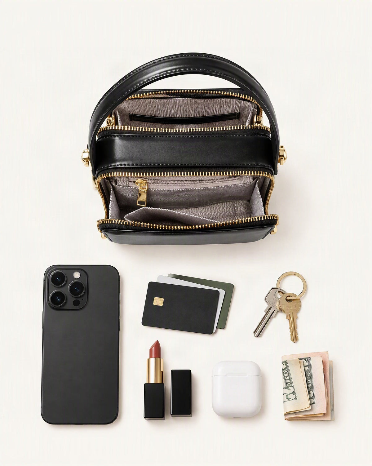 What fits in the Cowhide Leather Micro Box Bag Top Handle Crossbody: smartphone up to 6.9 in, cards, keys, a lipstick, airpods in their case, a few banknotes folded over into a small stack, no complete flat bill face showing