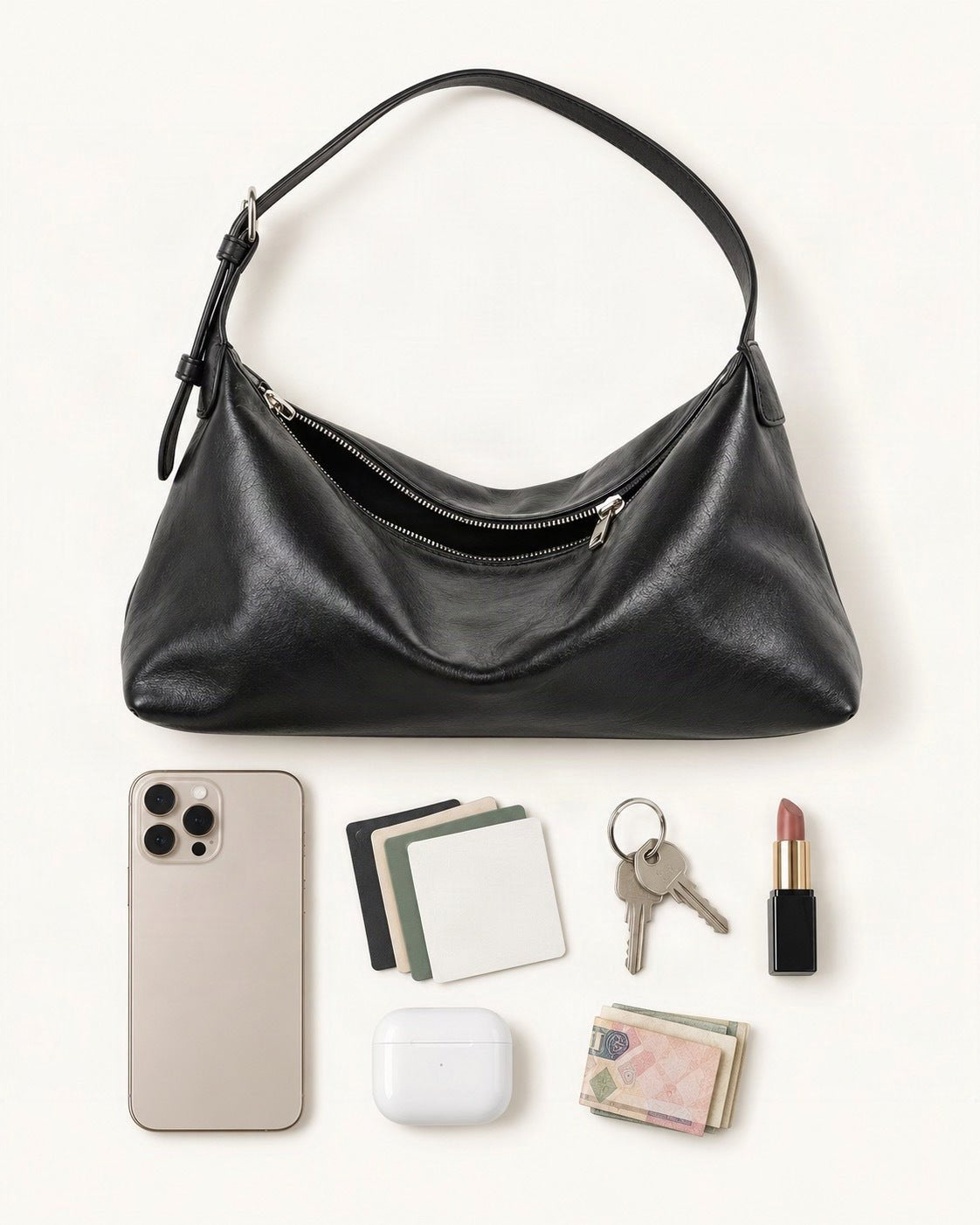 What fits in the Top-Grain Cowhide Hobo Shoulder Bag – Color Options: a 6.9-inch phone (iPhone 16 Pro Max), cards, keys, a lipstick, AirPods in their case, folded notes