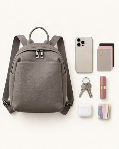 What fits in the Top-Grain Cowhide Small Backpack – Color Options: smartphone up to 6.9 in, cards, keys, a lipstick, airpods in their case, a few banknotes folded over into a small stack, no complete flat bill face showing