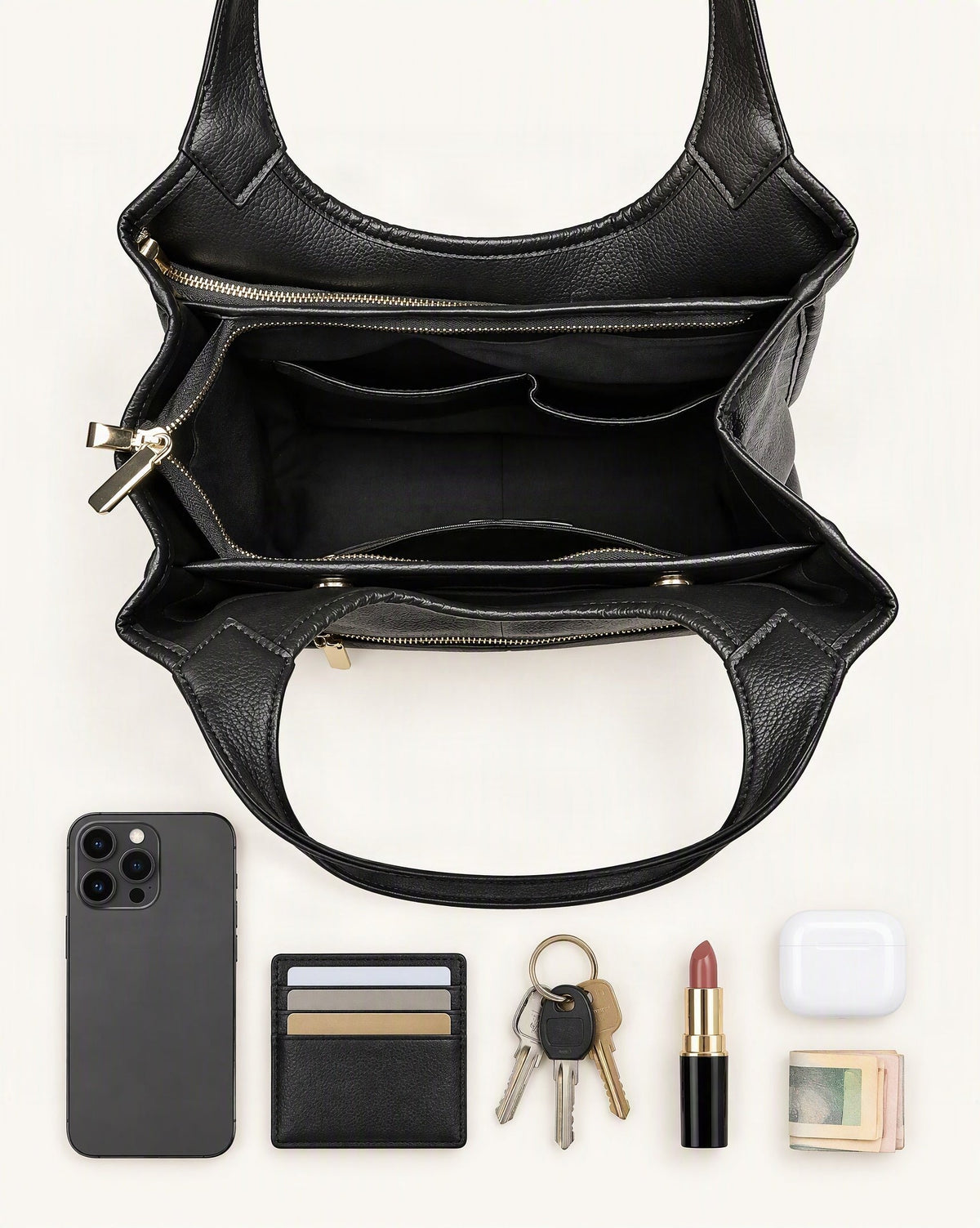 What fits in the Top-Grain Cowhide Leather Tote Shoulder Bag: smartphone up to 6.9 in, cards, keys, a lipstick, airpods in their case, a few banknotes folded over into a small stack, no complete flat bill face showing