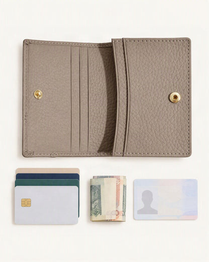 What fits in the Cowhide Leather Mini Bifold Card Holder Wallet: cards, a few banknotes folded over into a small stack, no complete flat bill face showing, an id card