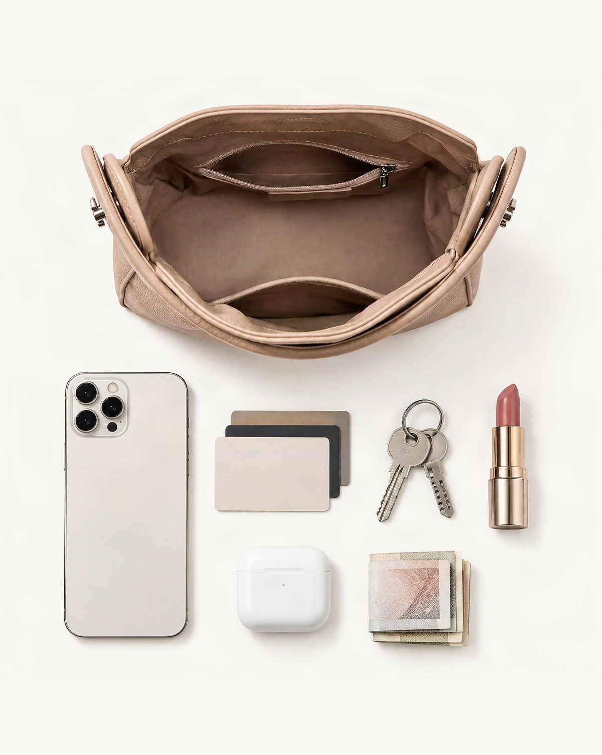 What fits in the Pebbled Cowhide Leather Small Top-Handle Crossbody Bag: smartphone up to 6.9 in, cards, keys, a lipstick, airpods in their case, a few banknotes folded over into a small stack, no complete flat bill face showing