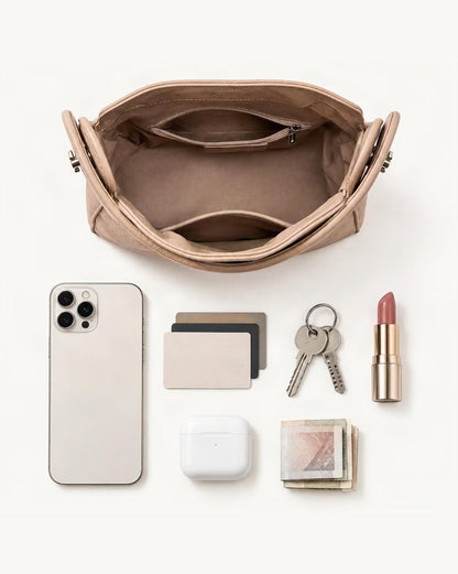 What fits in the Pebbled Cowhide Leather Small Top-Handle Crossbody Bag: smartphone up to 6.9 in, cards, keys, a lipstick, airpods in their case, a few banknotes folded over into a small stack, no complete flat bill face showing
