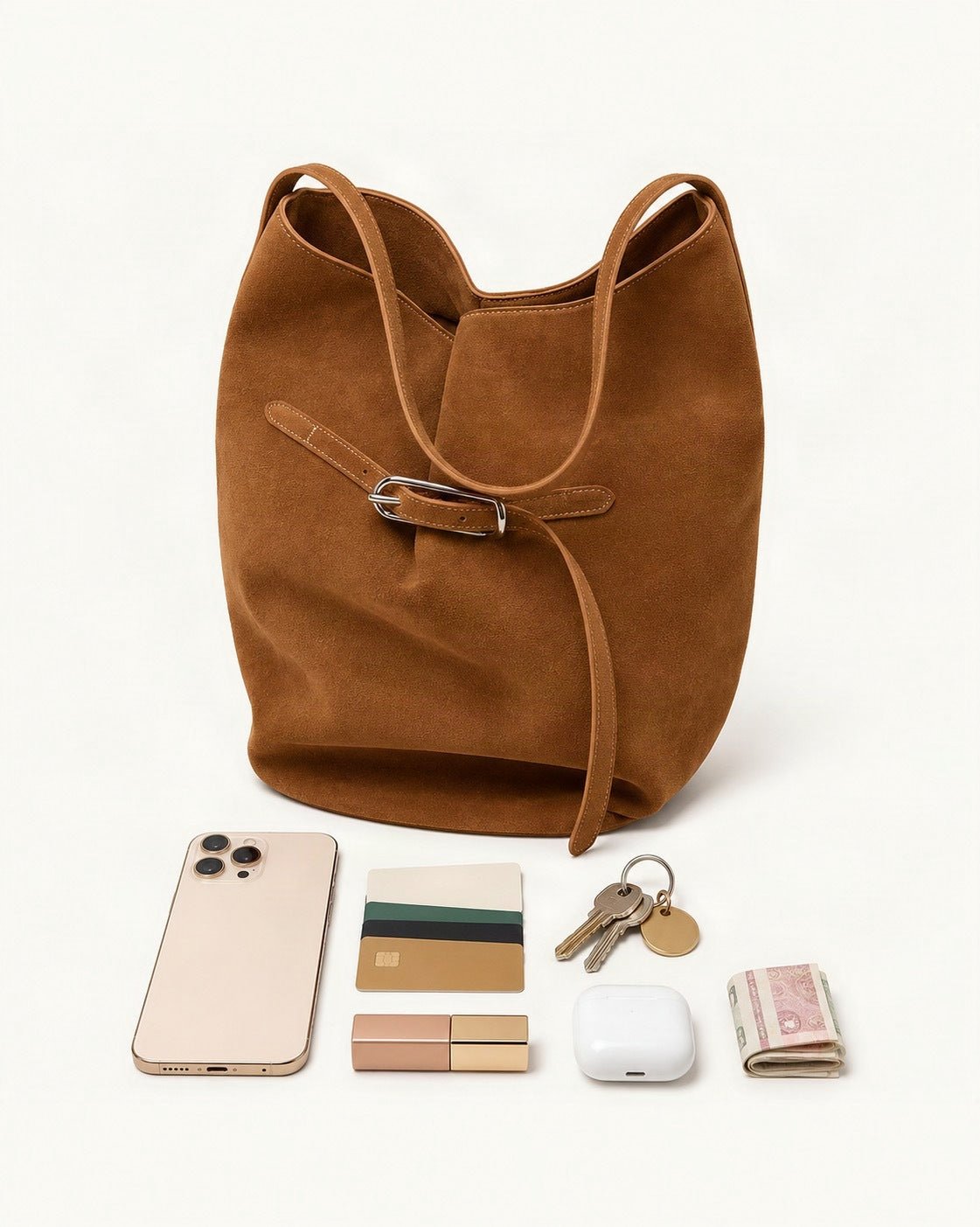What fits in the Suede Cowhide Shoulder Tote Bag: a 6.9-inch phone (iPhone 16 Pro Max), cards, keys, a lipstick, AirPods in their case, folded notes