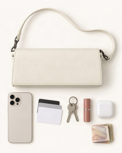 What fits in the Top-Grain Cowhide Flap Shoulder Bag: smartphone up to 6.9 in, cards, keys, a lipstick, airpods in their case, a few banknotes folded over into a small stack, no complete flat bill face showing