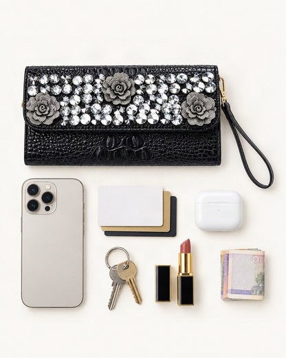What fits in the Split Leather Embellished Clutch: smartphone up to 6.9 in, cards, keys, a lipstick, airpods in their case, a few banknotes folded over into a small stack, no complete flat bill face showing