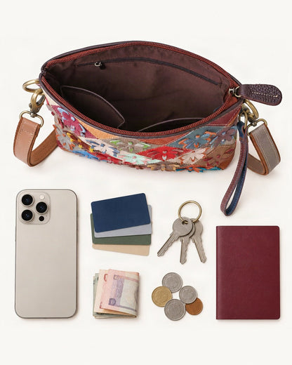 What fits in the Top-Grain Cowhide Small Shoulder Bag – Multicolor Patchwork: smartphone up to 6.9 in, cards, keys, a few banknotes folded over into a small stack, no complete flat bill face showing, coins, a passport