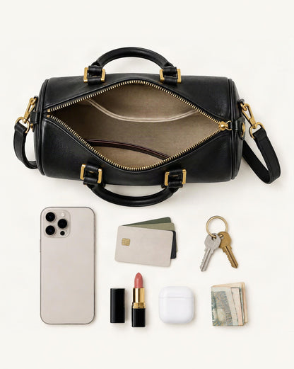 What fits in the Cowhide Leather Small Boston Bag Top Handle Crossbody: smartphone up to 6.9 in, cards, keys, a lipstick, airpods in their case, a few banknotes folded over into a small stack, no complete flat bill face showing