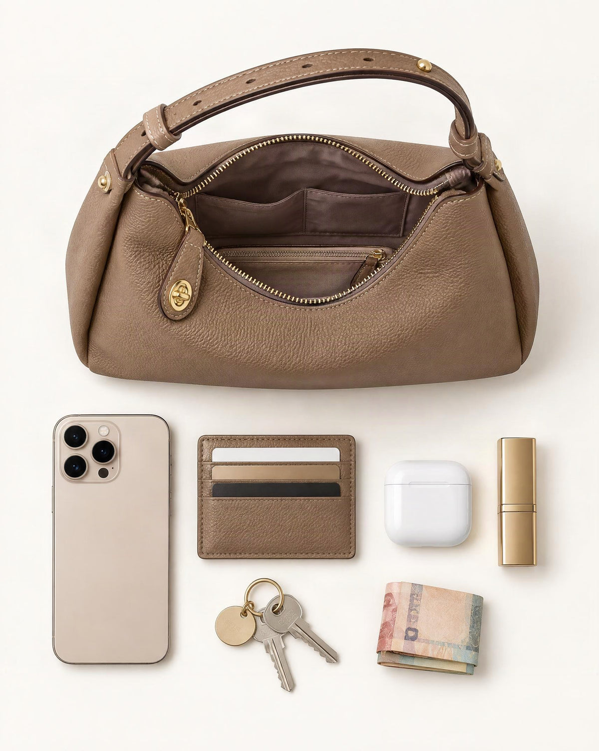 What fits in the Cowhide Leather Small Plus Shoulder Bag: smartphone up to 6.9 in, cards, keys, a lipstick, airpods in their case, a few banknotes folded over into a small stack, no complete flat bill face showing
