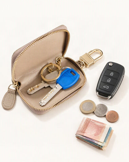 What fits in the Genuine Leather Zip-Around Key Pouch with Carabiner Clip: house keys, a car key fob, coins, a few banknotes folded over into a small stack, no complete flat bill face showing