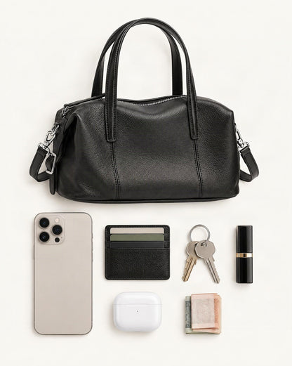 What fits in the Top-Grain Cowhide Soft Pillow Bag – Retro Boston Crossbody: smartphone up to 6.9 in, cards, keys, a lipstick, airpods in their case, a few banknotes folded over into a small stack, no complete flat bill face showing