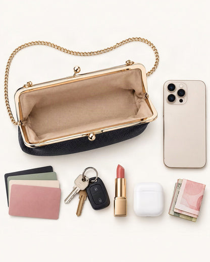 What fits in the Top-Grain Cowhide Frame Crossbody Bag: smartphone up to 6.9 in, cards, keys, a lipstick, airpods in their case, a few banknotes folded over into a small stack, no complete flat bill face showing