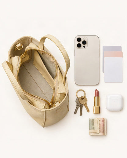 What fits in the Top-Grain Cowhide Mini Tote Bag – Color Options: smartphone up to 6.9 in, cards, keys, a lipstick, airpods in their case, a few banknotes folded over into a small stack, no complete flat bill face showing