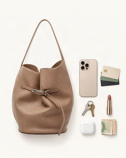 What fits in the Top-Grain Cowhide Small Shoulder Tote Bag: a 6.9-inch phone (iPhone 16 Pro Max), cards, keys, a lipstick, AirPods in their case, folded notes