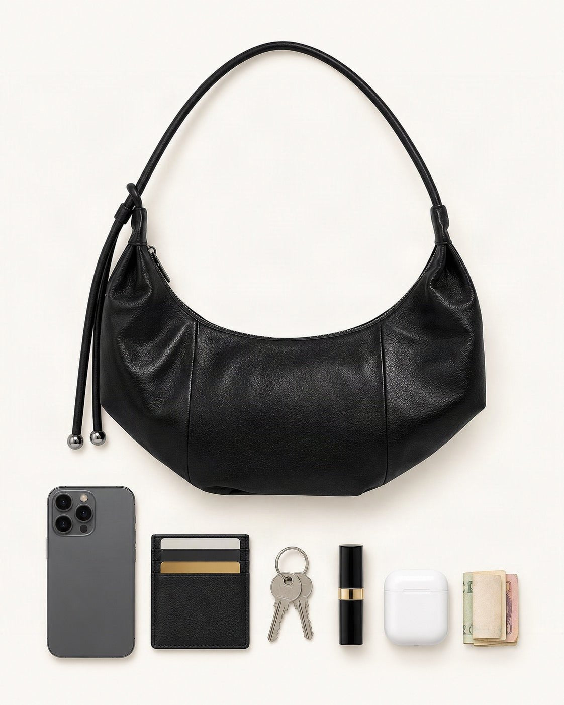 What fits in the Top-Grain Cowhide Crescent Hobo Bag, Soft Crescent Crossbody: smartphone up to 6.9 in, cards, keys, a lipstick, airpods in their case, a few banknotes folded over into a small stack, no complete flat bill face showing
