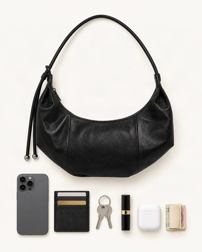 What fits in the Top-Grain Cowhide Crescent Hobo Bag, Soft Crescent Crossbody: smartphone up to 6.9 in, cards, keys, a lipstick, airpods in their case, a few banknotes folded over into a small stack, no complete flat bill face showing