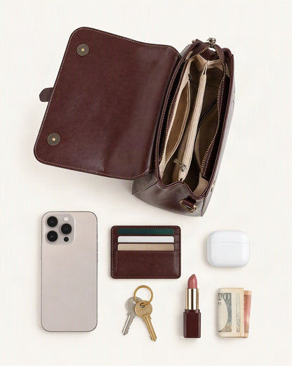 What fits in the Cowhide Leather Small Boston Crossbody Bag with Top Handle: smartphone up to 6.9 in, cards, keys, a lipstick, airpods in their case, a few banknotes folded over into a small stack, no complete flat bill face showing