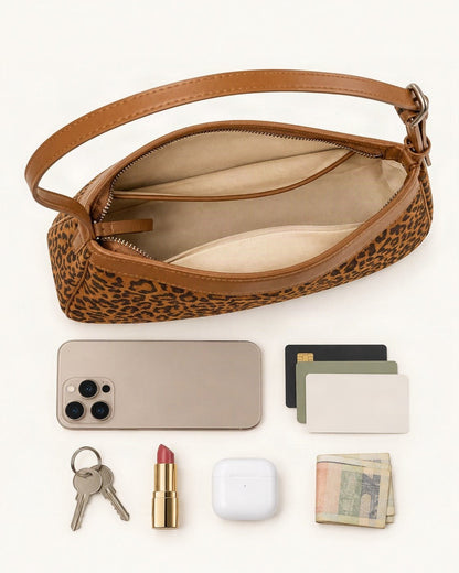 What fits in the Suede and Cowhide Small Crossbody Bag: a 6.9-inch phone (iPhone 16 Pro Max), cards, keys, a lipstick, AirPods in their case, folded notes