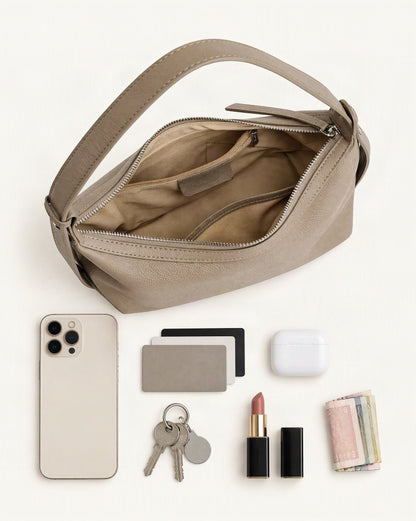 What fits in the Top-Grain Cowhide Leather Hobo Bag: smartphone up to 6.9 in, cards, keys, a lipstick, airpods in their case, a few banknotes folded over into a small stack, no complete flat bill face showing
