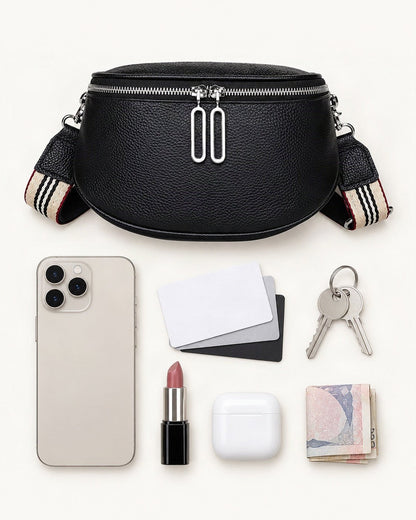 What fits in the Cowhide Mini Crossbody Bag: smartphone up to 6.9 in, cards, keys, a lipstick, airpods in their case, a few banknotes folded over into a small stack, no complete flat bill face showing