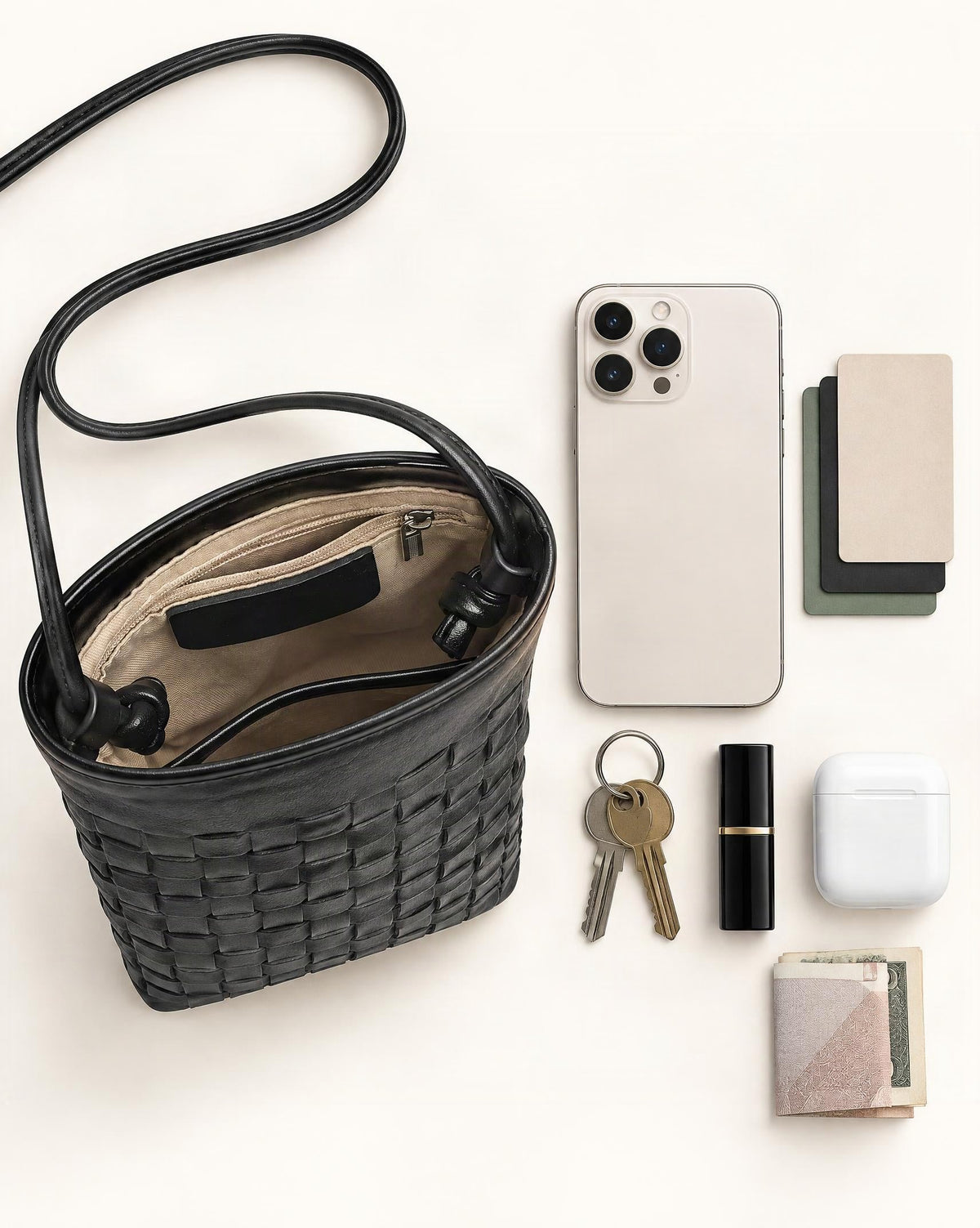 What fits in the Lambskin Micro Crossbody Phone Bag: smartphone up to 6.9 in, cards, keys, a lipstick, airpods in their case, a few banknotes folded over into a small stack, no complete flat bill face showing