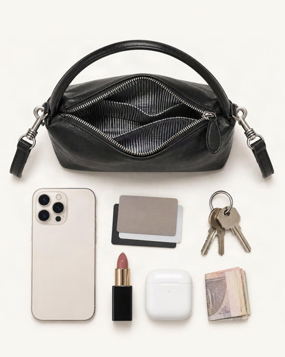 What fits in the Top-Grain Cowhide Pillow Bag with Detachable Strap: smartphone up to 6.9 in, cards, keys, a lipstick, airpods in their case, a few banknotes folded over into a small stack, no complete flat bill face showing
