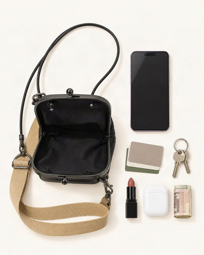 What fits in the Leather Mini Shoulder Bag: smartphone up to 6.9 in, cards, keys, a lipstick, airpods in their case, a few banknotes folded over into a small stack, no complete flat bill face showing