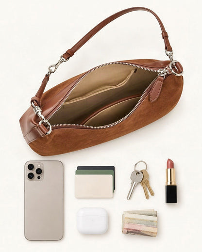 What fits in the Cowhide Suede-Panel Shoulder Bag: a 6.9-inch phone (iPhone 16 Pro Max), cards, keys, a lipstick, AirPods in their case, folded notes