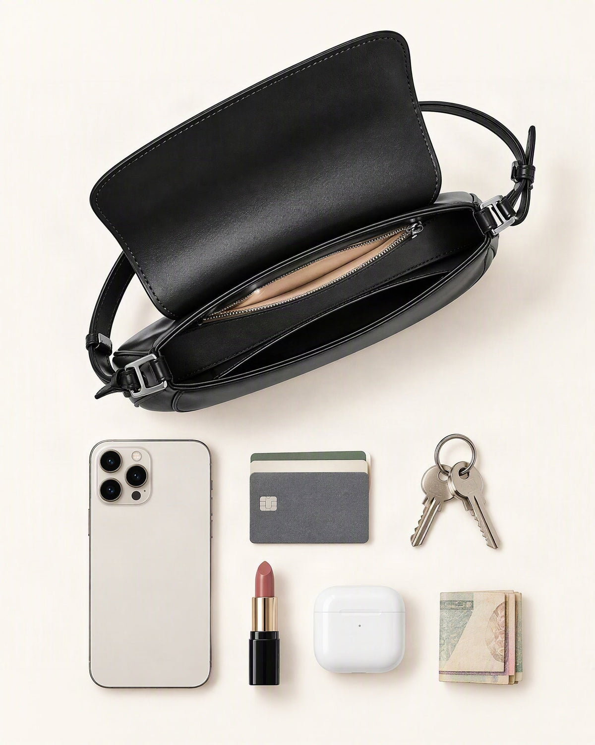 What fits in the Genuine Cowhide Leather Baguette Shoulder Bag: smartphone up to 6.9 in, cards, keys, a lipstick, airpods in their case, a few banknotes folded over into a small stack, no complete flat bill face showing
