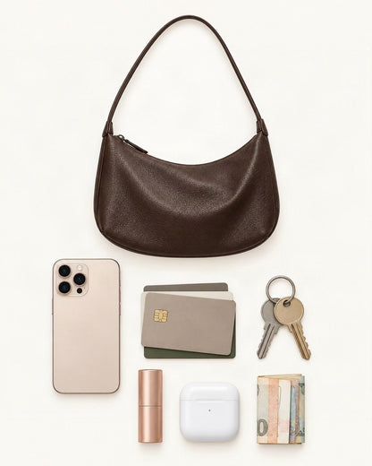 What fits in the Top-Grain Cowhide Shoulder Hobo Bag: a 6.9-inch phone (iPhone 16 Pro Max), cards, keys, a lipstick, AirPods in their case, folded notes