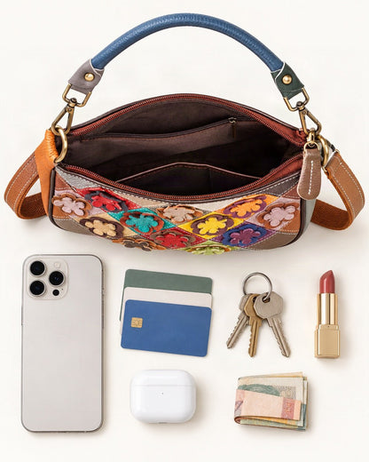 What fits in the Top-Grain Cowhide Small Crossbody Bag – Random Multicolor: smartphone up to 6.9 in, cards, keys, a lipstick, airpods in their case, a few banknotes folded over into a small stack, no complete flat bill face showing