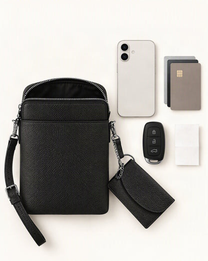 What fits in the Top-Grain Cowhide Leather Mini Crossbody Phone Bag: a 6.3-inch phone (iphone 16), cards, a car key fob, folded notes or a receipt