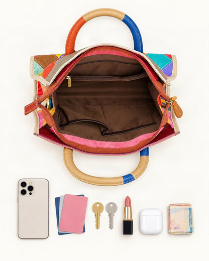 What fits in the Top-Grain Cowhide Small Plus Patchwork Shoulder Bag: smartphone up to 6.9 in, cards, keys, a lipstick, airpods in their case, a few banknotes folded over into a small stack, no complete flat bill face showing