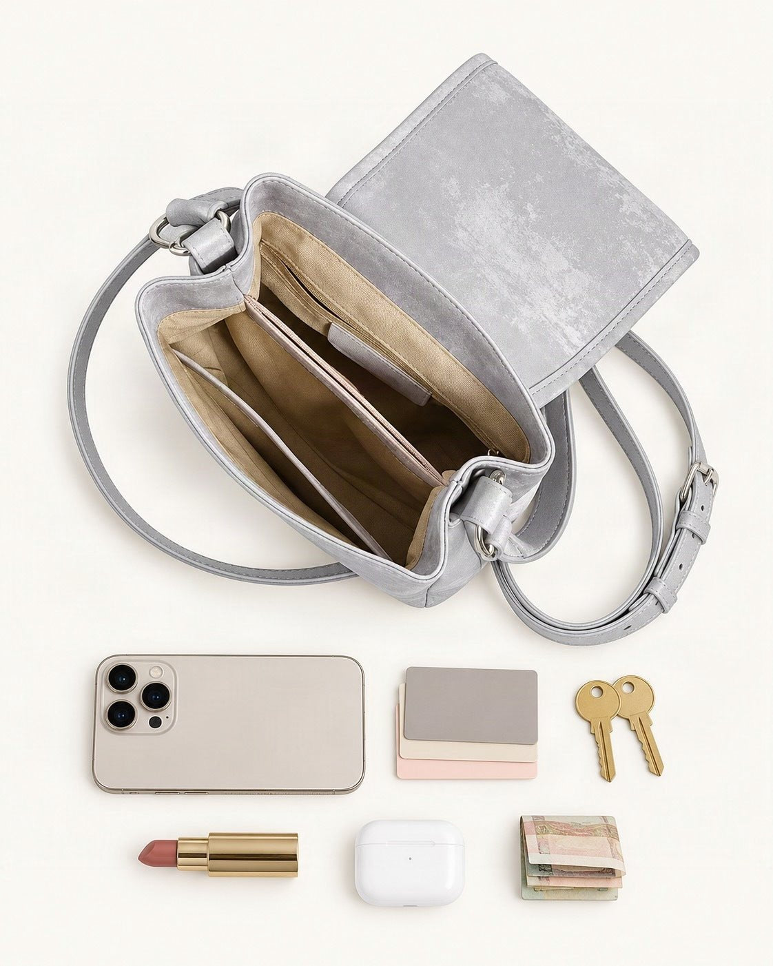 What fits in the Split Leather Small Bucket Bag with Magnetic Flap: a 6.9-inch phone (iPhone 16 Pro Max), cards, keys, a lipstick, AirPods in their case, folded notes