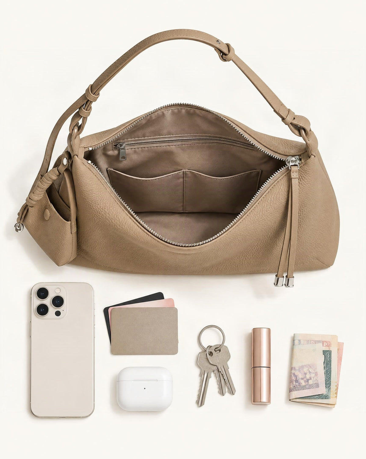 What fits in the Cowhide Leather Soft Hobo Shoulder Bag: smartphone up to 6.9 in, cards, keys, a lipstick, airpods in their case, a few banknotes folded over into a small stack, no complete flat bill face showing